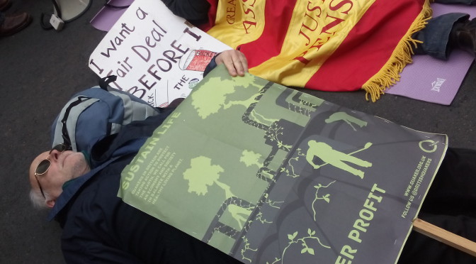 Colin Hall of Luton Quaker Meeting taking part in a ‘die-in’ for ‘No more deaths from fuel poverty: Energy Justice Now!’ Photo: (c) Sunniva Taylor for Britain Yearly Meeting